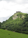 SX16166 Carreg Cennen Castle on top of distant cliffs.jpg